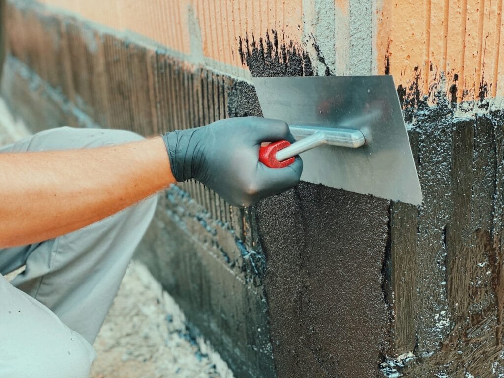 Coating hollow bricks